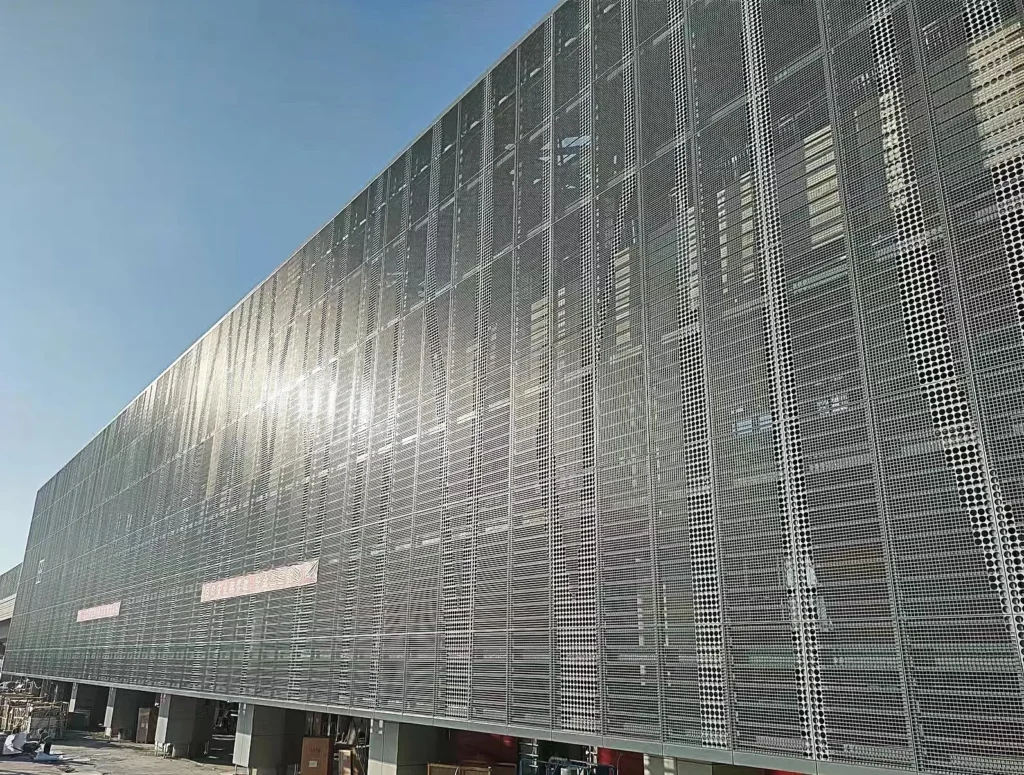 Perforated aluminum exterior wall panel building case